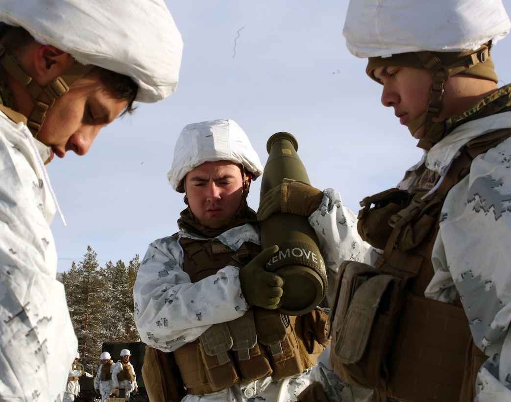 Lance Cpl. Joany Echeverry, cannoneer with Combined Arms Company, assists other team members in collecting the ammunition for a live-fire shoot in Rena, Norway, Feb. 23, 2016, in preparation for Exercise Cold Response 16. The exercise will include 12 NATO allies and partner nations, and approximately 16,000 troops. The Marines will provide indirect fire support for infantry units during the exercise.