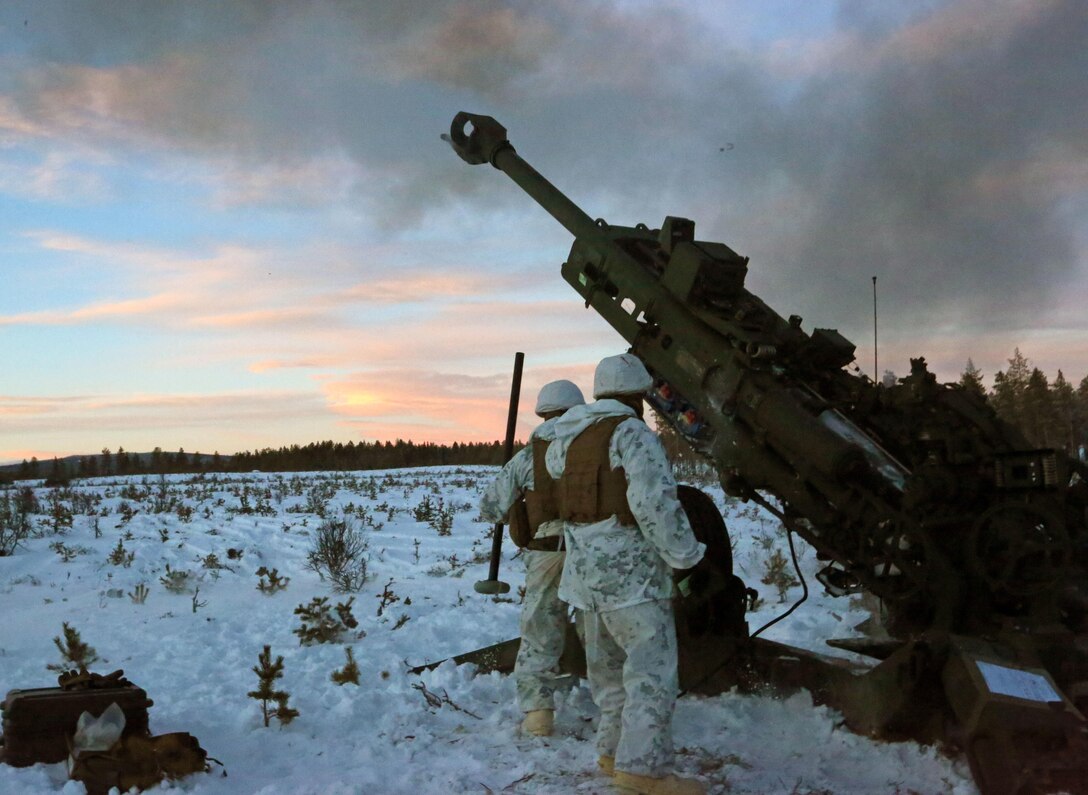 Marines with Combined Arms Company, step back as an M777 Howitzer fires a round during a live-fire shoot in Rena, Norway, Feb. 23, 2016, in preparation for Exercise Cold Response 16. The exercise will include 12 NATO allies and partner nations, and approximately 16,000 troops. The Marines will provide indirect fire support for infantry units during the exercise.