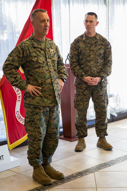Col. Peter Buck, Left, speaks to Marines after receiving a plaque of recognition from Lt. Col. Jan Durham aboard Marine Corps Air Station Beaufort Feb. 18. The plaque was accepted on behalf of the Provost Marshal’s Office who received federal accreditation from Headquarters Marine Corps. HQMC representatives visited Beaufort on several occasions during the accreditation process to evaluate each service section within PMO. Buck is the commanding officer of MCAS Beaufort. Durham is a representative of the Deputy Commandant of Security Plans, Policies, and Operations Security Division.