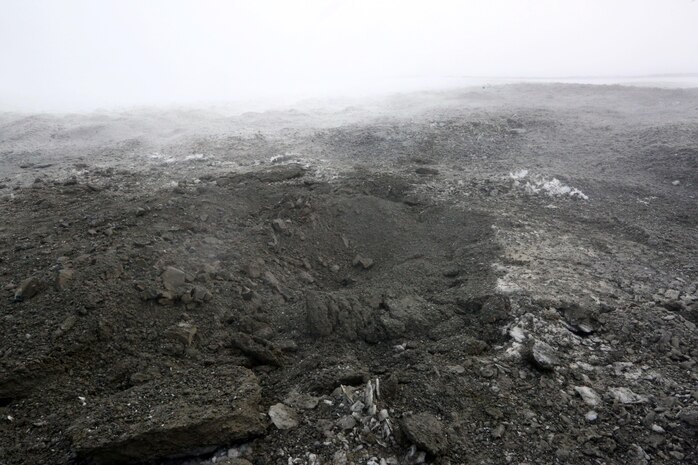 A crater emits smoke in the aftermath of a controlled explosion in Rena, Norway, Feb. 22, 2016. Marines with 2nd Explosive Ordnance Disposal Company, Combat Logistics Battalion 252 tested the effects of various amounts of explosives in the snow in preparation for Exercise Cold Response 2016. The exercise will include 12 NATO allies and partner nations, and approximately 16,000 troops. Marines will train alongside Norwegian EOD specialists to see how they operate in order to become more proficient at working with each other in the future.