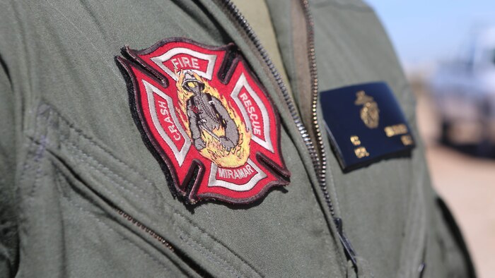 An Aircraft Rescue and Firefighting Marine participates in testing to become certified to operate a Mobile Aircraft Fire Training Device at Marine Corps Air Station Miramar, California, Feb. 22. The MAFTD is used by ARFF to conduct live-fire training. The MAFTD is computer-operated and the different functions are controlled via a panel. 