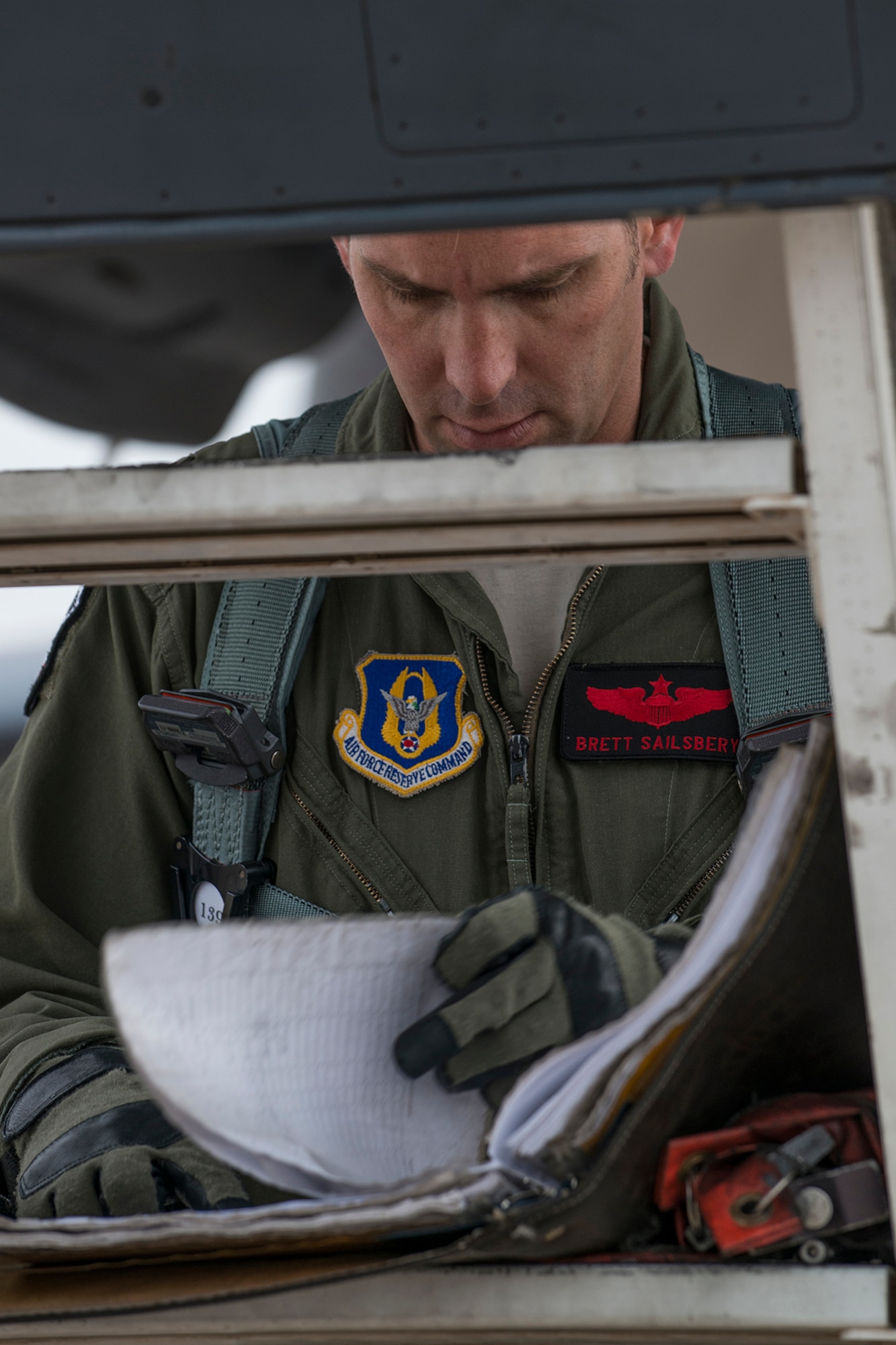 U.S. Air Force Maj. Brett Sailsbury checks the aircraft forms of a B-1 Lancer prior to a mission on Feb. 20, 2016, Dyess Air Force Base, Texas. Sailsbury is a B-1 pilot assigned to the Air Force Reserve Command’s 345th Bomb Squadron. (U.S. Air Force photo by Master Sgt. Greg Steele/Released)