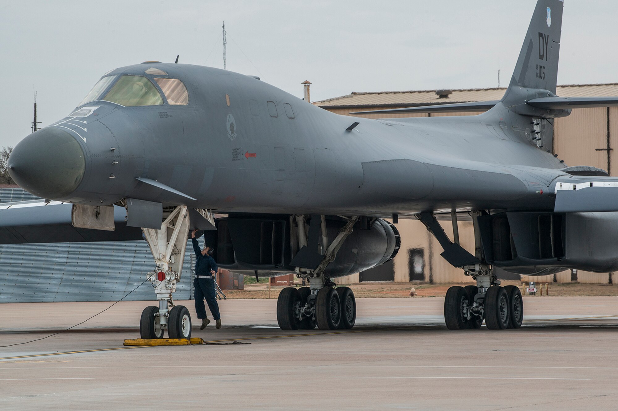 A 489th Maintenance Squadron crew chief jumps to close the cockpit hatch of a 7th Bomb Wing B-1 Lancer prior to a mission on Feb. 20, 2016, Dyess Air Force Base (AFB), Texas. The squadron is assigned to the Air Force Reserve Command’s 489th Bomb Group at Dyess, which assigned to the 307th Bomb Wing at Barksdale Air Force Base, La. (U.S. Air Force photo by Master Sgt. Greg Steele/Released)