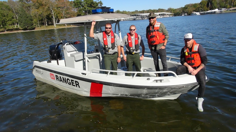 Preston Brust (second from right) and Chris Lucas (Right) of the country music duo LoCash pose with U.S. Army Corps of Engineers Park Rangers Jacob Albers (Left) and Brent Sewell at Old Hickory Lake in Hendersonville, Tenn, Oct. 19, 2015.  The group filmed a water safety PSA that features LoCash’s hit song "I Love This Life," which is currently moving up the country music charts. It is being used to support the USACE National Water Safety Campaign “Life Jackets Worn, Nobody Mourns.”