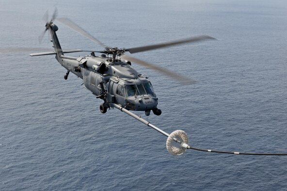 An HH-60G Pave Hawk assigned to the 33rd Rescue Squadron performs in-flight refueling during a training exercise Feb. 17, 2016, off the coast of Okinawa, Japan. The 33rd RQS performs military personnel recovery, civil search and rescue, medical evacuation, disaster response, and humanitarian assistance. (U.S. Air Force photo/Senior Airman Peter Reft)                           