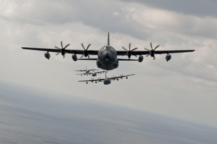 MC-130J Command IIs assigned to the 17th Special Operations Squadron fly in formation Feb. 17, 2016, off the coast of Okinawa, Japan. The 17th SOS conducted a unit-wide training exercise which tasked the entire squadron with a quick-reaction, full-force sortie involving a five-ship formation flight, cargo drops, short runway landings and takeoffs, and helicopter air-to-air refueling. (U.S. Air Force photo/Senior Airman Peter Reft)                  