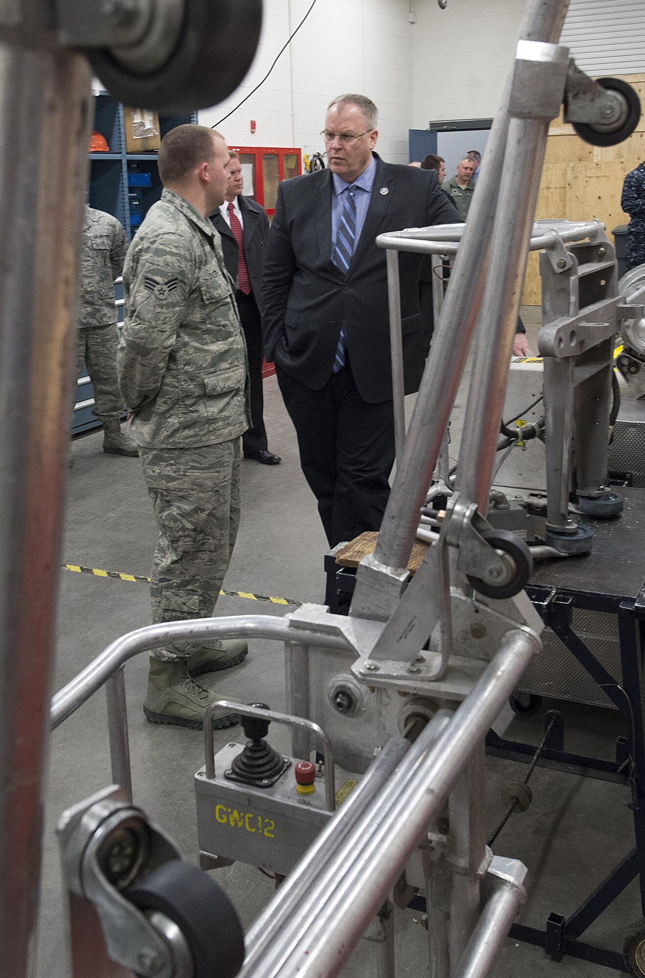 Senior Airman Joshua Chester, 90th Maintenance Operations Squadron, discusses his shop’s mission with Deputy Secretary of Defense Bob Work, Feb. 24, 2015, during a visit by Work to F.E. Warren AFB, Wyo. Work came to the base to be briefed on the state of the nation’s nuclear deterrence and to talk with the Airmen doing the job. (U.S. Air Force photo by R.J. Oriez)