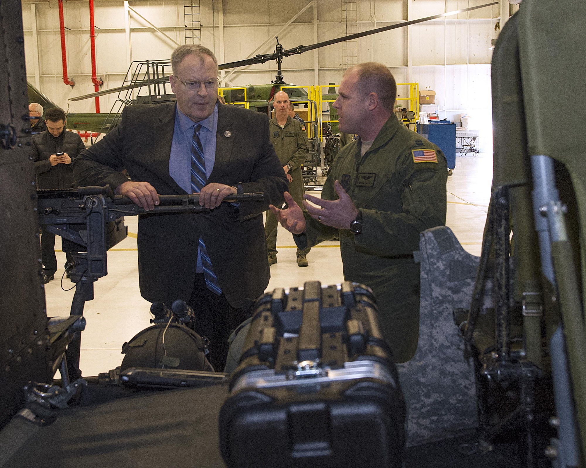 Capt, Derek Carden, 37th Helicopter Squadron pilot, briefs Deputy Secretary of Defense Bob Work, Feb. 24, 2015, on the capabilities and challenges of the UH-1N Huey helicopter as it is used by the U.S. Air Force’s missile wings. Work visited the 90th MW and F.E. Warren Air Force Base, Wyo., to be briefed on the state of the nation’s nuclear deterrence and to talk with the Airmen doing the job. (U.S. Air Force photo by R.J. Oriez)