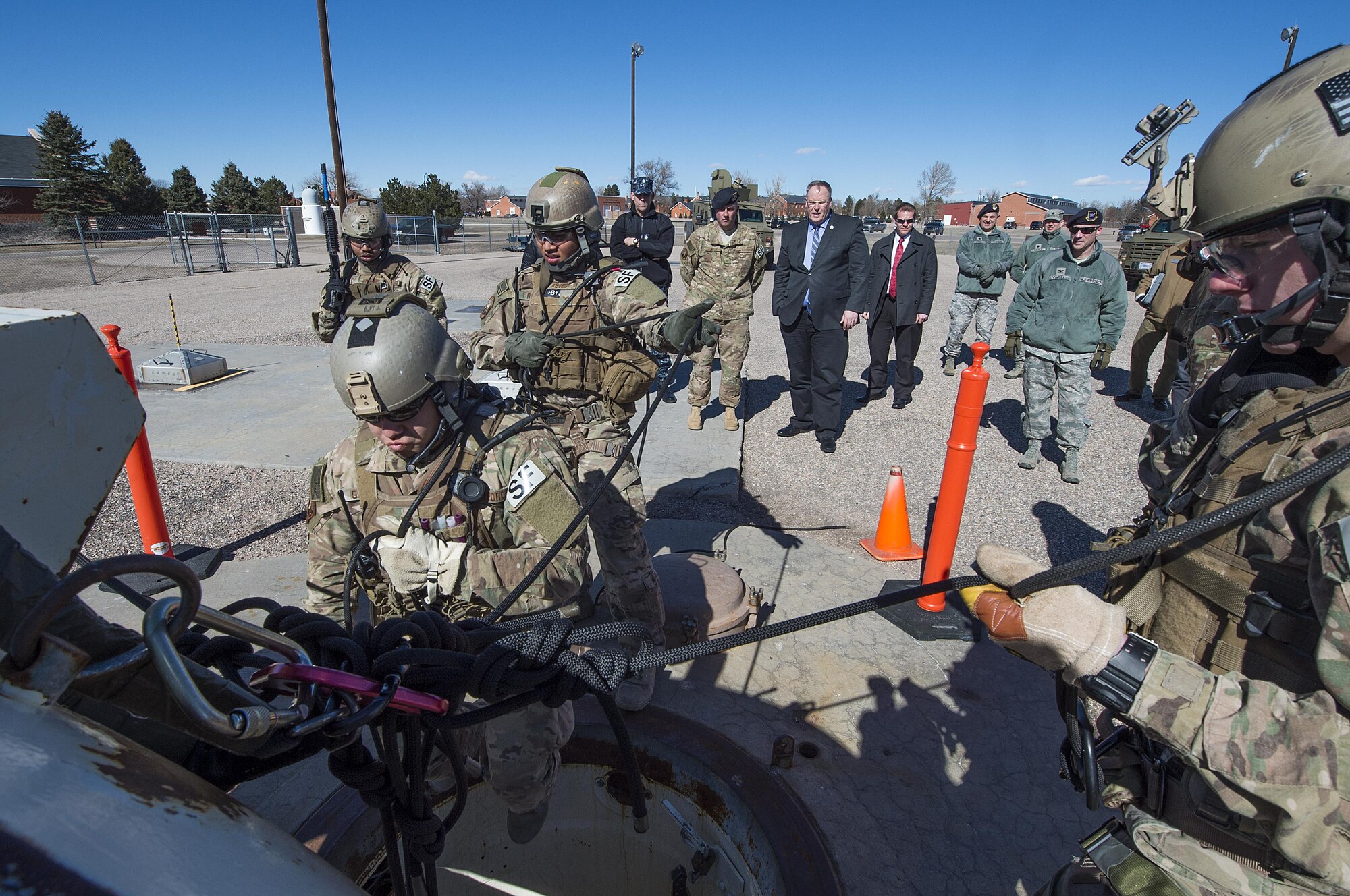Members of 790th Missile Security Forces Squadron’s Tactical Response Force repel through the access hatch on at a training launch facility on F.E. Warren Air Force Base, Wyo., Feb. 24, 2016. The team was demonstrating LF recapture techniques for Deputy Secretary of Defense Bob Work, who was visiting the base to be briefed on the state of the nation’s nuclear deterrence and to talk with the Airmen doing the job. (U.S. Air Force photo by R.J. Oriez)