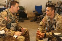 Army Reserve Sgt. Aaron Ellerman (left), a print journalist from the 204th Public Affairs Detachment in Orlando, Fla., interviews Chief Warrant Officer 2 Andres Arango, an allied trades warrant officer with the 542nd Sustainment Maintenance Company, during Exercise News Day at Fort Polk, La. Ellerman and other Army Reserve public affairs Soldiers were tested on their ability to tell the Army story from a field environment — in this case Joint Readiness Training Center Rotation 16-04, where Soldiers were engaged in a combat training scenario. (U.S. Army photo by Sgt. Brandon Hubbard, 204th Public Affairs Detachment/Released)