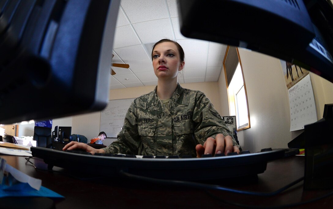 U.S. Air Force Airman 1st Class Chelsea Walters, a 354th Force Support Squadron customer service apprentice, responds to an email from a customer, Feb. 25, 2016, at Eielson Air Force Base, Alaska.  Walters works for the Military Personnel Section documenting awards, decorations, in-processing paperwork and more for Airmen. (U.S. Air Force photo by Airman 1st Class Cassandra Whitman/Released)