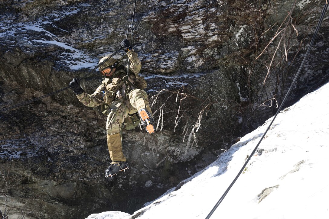 A soldier rappels down the face of a cliff on Smugglers’ Notch in Jeffersonville, Vt., Feb. 18, 2016. Vermont Army National Guard photo by Staff Sgt. Nathan Rivard