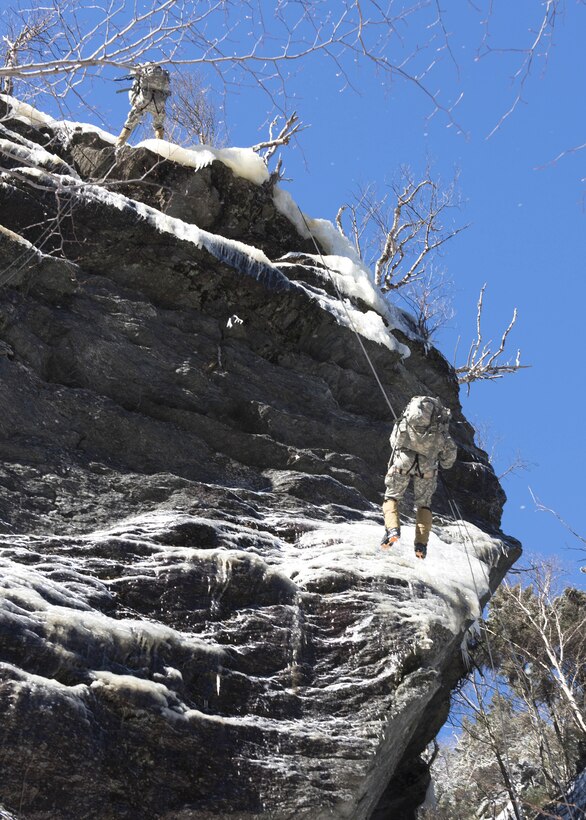 Soldiers rappel down the face of a cliff on Smugglers’ Notch in Jeffersonville, Vt., Feb. 18, 2016. Vermont Army National Guard photo by Staff Sgt. Nathan Rivard