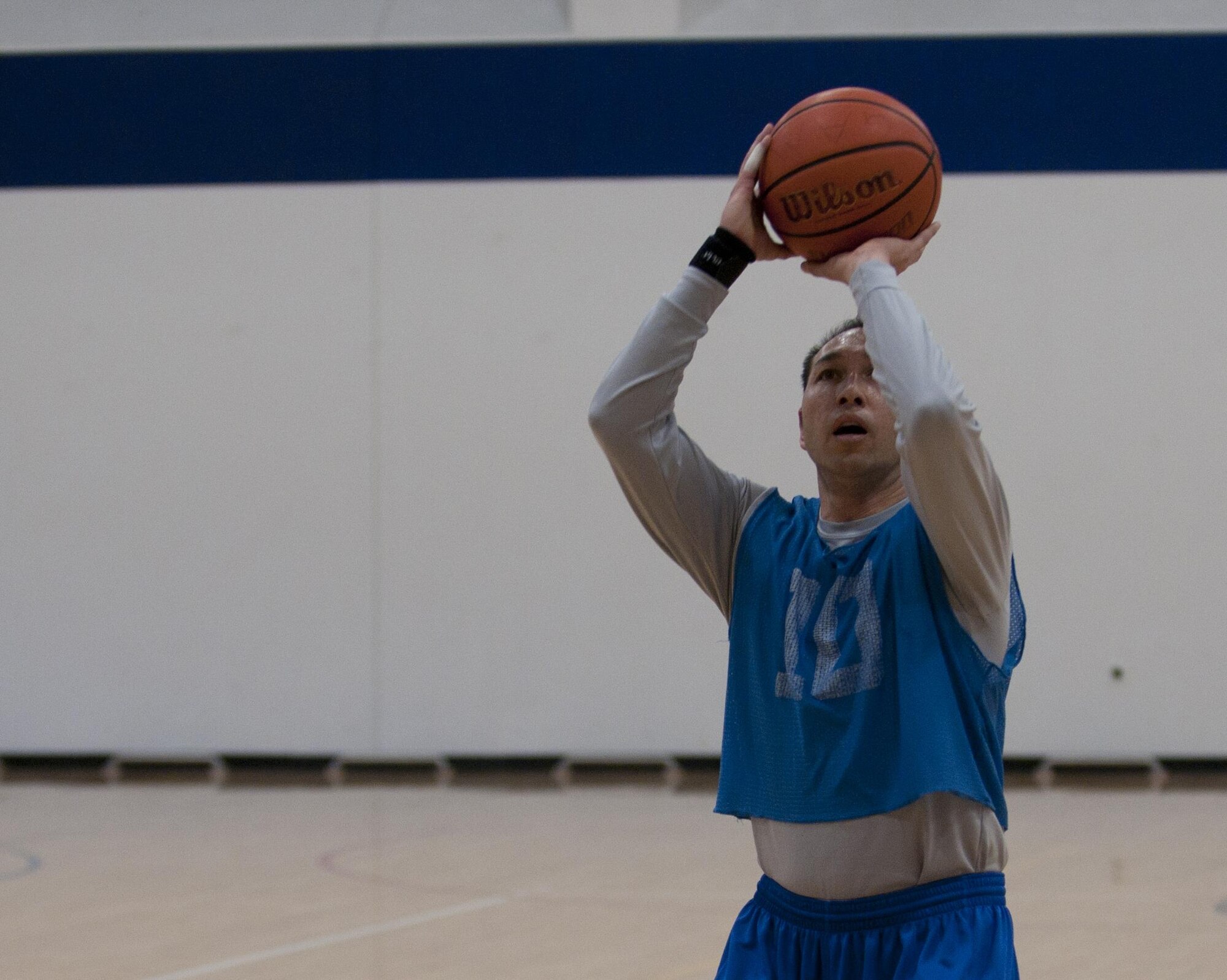 David Rivera, 90th Force Support Squadron Basketball Team player, shoots a free throw during the championship game, Feb. 24, 2016 in the Freedom Hall Fitness Center. Through the season, FSS remained undefeated until their championship game against the 90th Maintenance Group Basketball Team. (U.S. Air Force photo by Airman 1st Class Malcolm Mayfield)