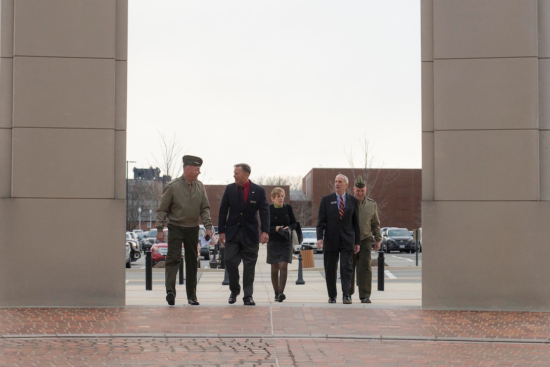 Marine Corps Gen. Joseph F. Dunford, Jr., chairman of the Joint Chiefs of Staff, left, speaks to retired Marine Corps Gen. William L. "Spider" Nyland, a senior mentor for the National Defense University's Capstone program, on Fort McNair in Washington, D.C., Feb. 26, 2016. The Capstone program focuses on making military leaders more effective in planning and employing U.S. forces in joint and combined operations. Courses examine the decision-making process for a variety of concerns, including national security, military strategy and interoperability. Navy Petty Officer 2nd Class Dominique Pineiro