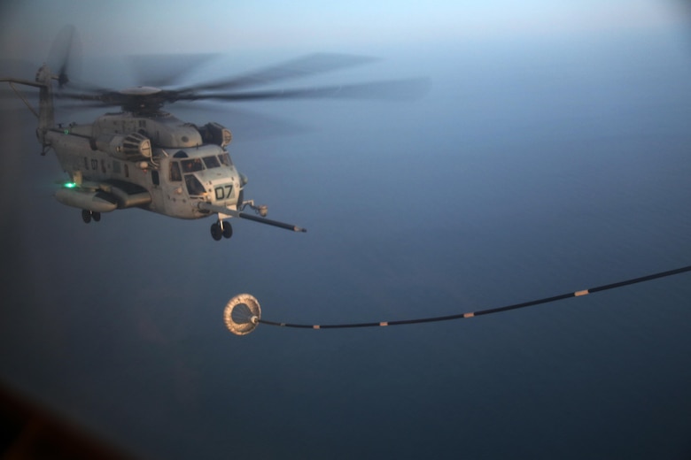 A CH-53E Super Stalion approaches a refueling hose during an aerial refueling mission over the Atlantic Ocean Feb. 11, 2016. Marine Aerial Refueler Transport Squadron 252 conducted aerial refueling missions off the North Carolina coast to provide routine training for both pilots and crew members. Aerial refueling enables aircraft with short ranges of flight to significantly extend their operational reach. This capability enables missions to be executed more efficiently, which gives the pilots the ability to provide quicker and more extensive support to the Marines on the ground. (U.S. Marine Corps photo by Cpl. N.W. Huertas/Released)