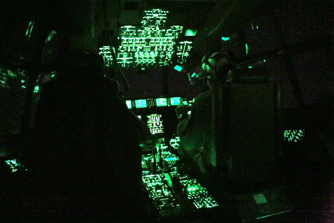 Pilots maneuver through the sky utilizing night vision goggles during an aerial refueling mission over the Atlantic Ocean Feb. 11, 2016. Marine Aerial Refueler Transport Squadron 252 conducted aerial refuels off the North Carolina coast to provide routine training for both pilots and crew members. Aerial refueling enables aircraft with short ranges of flight to significantly extend their operational reach. This capability enables missions to be executed more efficiently, which gives the pilots the ability to provide quicker and more extensive support to the Marines on the ground. (U.S. Marine Corps photo by Cpl. N.W. Huertas/Released)