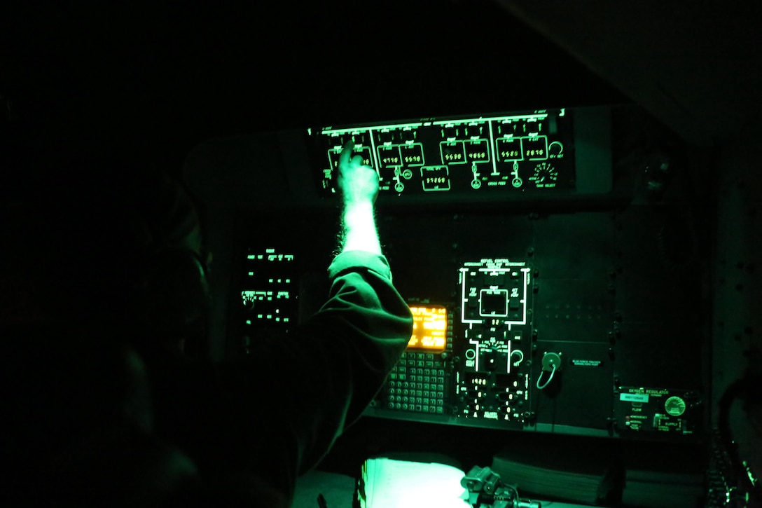 Staff Sgt. Jeremiah Gaulitz operates the controls during aerial refueling mission over the Atlantic Ocean Feb. 11, 2016. Marine Aerial Refueler Transport Squadron 252 conducted aerial refuels off the North Carolina coast to provide routine training for both pilots and crew members. Aerial refueling enables aircraft with short ranges of flight to significantly extend their operational reach. This capability enables missions to be executed more efficiently, which gives the pilots the ability to provide quicker and more extensive support to the Marines on the ground. Guilitz is a crew master with the squadron. (U.S. Marine Corps photo by Cpl. N.W. Huertas/Released)