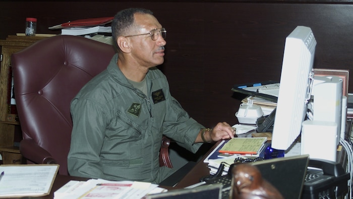 Charles “Charlie” Bolden, the 12th Administrator of the National Aeronautics and Space Administration works at his desk at an unknown location and date. Bolden served 34 years on active duty in the Marines as a Naval aviator, spent 14 years as a member of NASA’s Astronaut Office and retired at the rank of major general. 