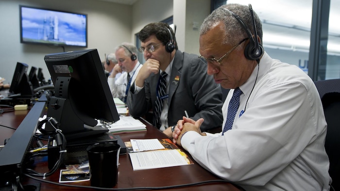 NASA Administrator Charles Bolden, right, monitors the countdown of the United Launch Alliance Atlas V rocket carrying the Mars Science Laboratory Curiosity along with NASA Associate Administrator Chris Scolese, Saturday, Nov. 26, 2011, at the ULA launch control center on Cape Canaveral Air Force Station, Fla.  NASA began a historic voyage to Mars with the launch of the car-sized rover which lifted off at 10:02 a.m. EST. The mission will pioneer precision landing technology and a sky-crane touchdown to place Curiosity near the foot of a mountain inside Gale Crater on Aug. 6, 2012. 