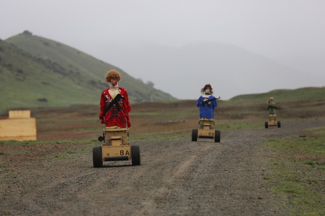 Autonomous Robotic Human Type Targets make their way off of a firing range Feb. 18, at Camp Pendleton. With their GPS and sensors on the front, the targets are able to navigate the range on command and will correct their own paths to avoid obstacles. Marines with Division Schools, 1st Marine Division, are testing this target to see if they can use it to evolve their training by creating more realistic, less predictable scenarios. (U.S. Marine Corps Photo by Cpl. John Baker)