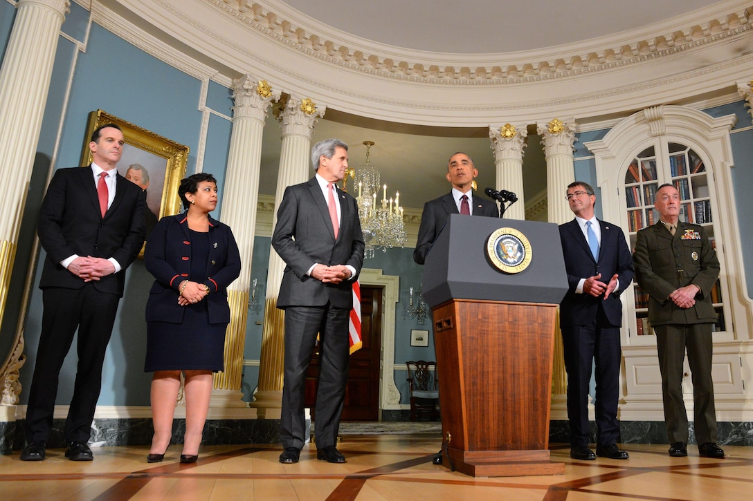 President Barack Obama, at lectern, delivers remarks on the global campaign to defeat with the Islamic State of Iraq and the Levant and other issues while joined by, from left, Brett McGurk, special presidential envoy for the global coalition to counter ISIL; Attorney General Loretta Lynch; Secretary of State John Kerry; Defense Secretary Ash Carter; and Marine Corps Gen. Joseph F. Dunford Jr., chairman of the Joint Chiefs of Staff Joseph Dunford, at the U.S. Department of State in Washington, D.C., Feb. 25, 2016. State Department photo