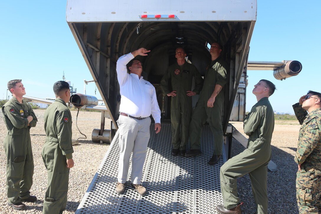 Greg Hudson, Mobile Aircraft Fire Training Device program manager and an Orlando, Fla., native, talks to the Marines about the functions of the Mobile Aircraft Fire Training Device aboard Marine Corps Air Station Miramar, Calif., Feb. 22. The MAFTD is a computer-operated device and the different functions are controlled via a panel. The MAFTD is used by Aircraft Rescue and Firefighting Marines to conduct live-fire training. (U.S. Marine Corps photo by Lance Cpl. Harley Robinson/Released)