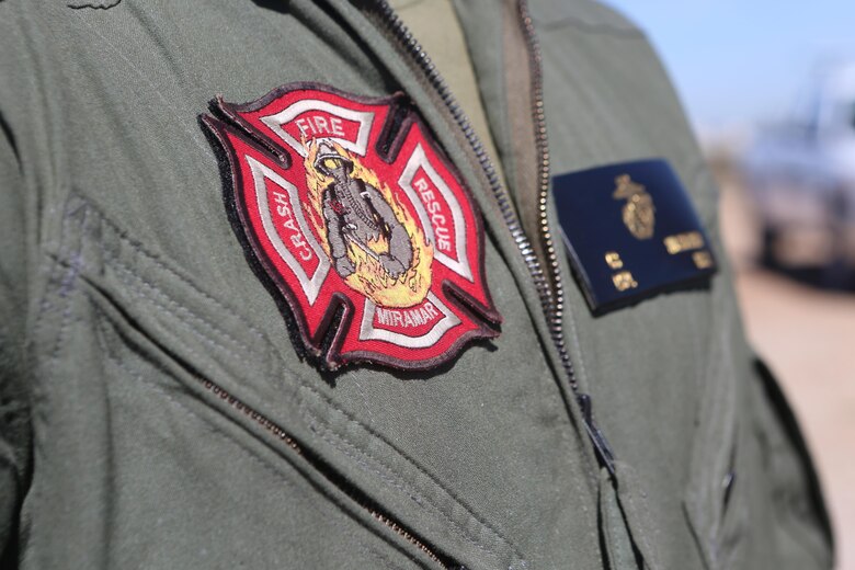 An Aircraft Rescue and Firefighting Marine participates in testing to become certified to operate a Mobile Aircraft Fire Training Device aboard Marine Corps Air Station Miramar, Calif., Feb. 22. The MAFTD is used by ARFF to conduct live-fire training. The MAFTD is computer-operated and the different functions are controlled via a panel. (U.S. Marine Corps photo by Lance Cpl. Harley Robinson/Released)