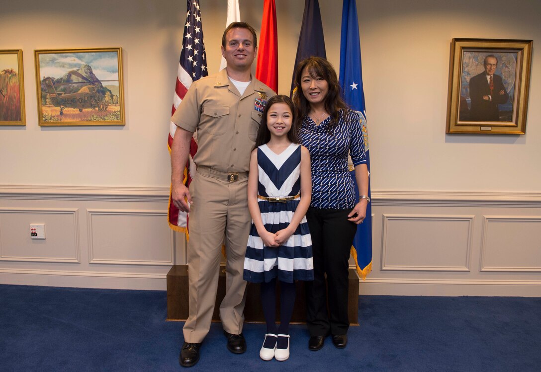 Navy Senior Chief Petty Officer Edward C. Byers Jr. and his family pose for a photo at the Pentagon, Feb. 26, 2016. DoD photo by Navy Petty Officer 1st Class Tim D. Godbee