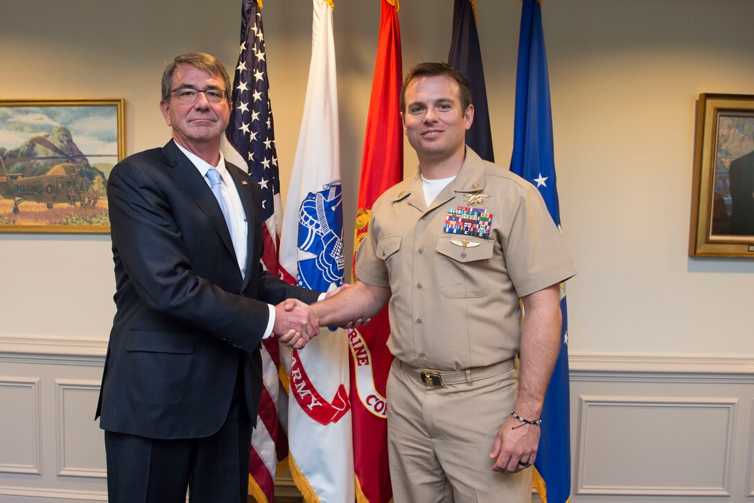 Defense Secretary Ash Carter poses for a photograph with Navy Senior Chief Petty Officer Edward C. Byers Jr. at the Pentagon, Feb. 26, 2016. DoD photo by Navy Petty Officer 1st Class Tim D. Godbee
