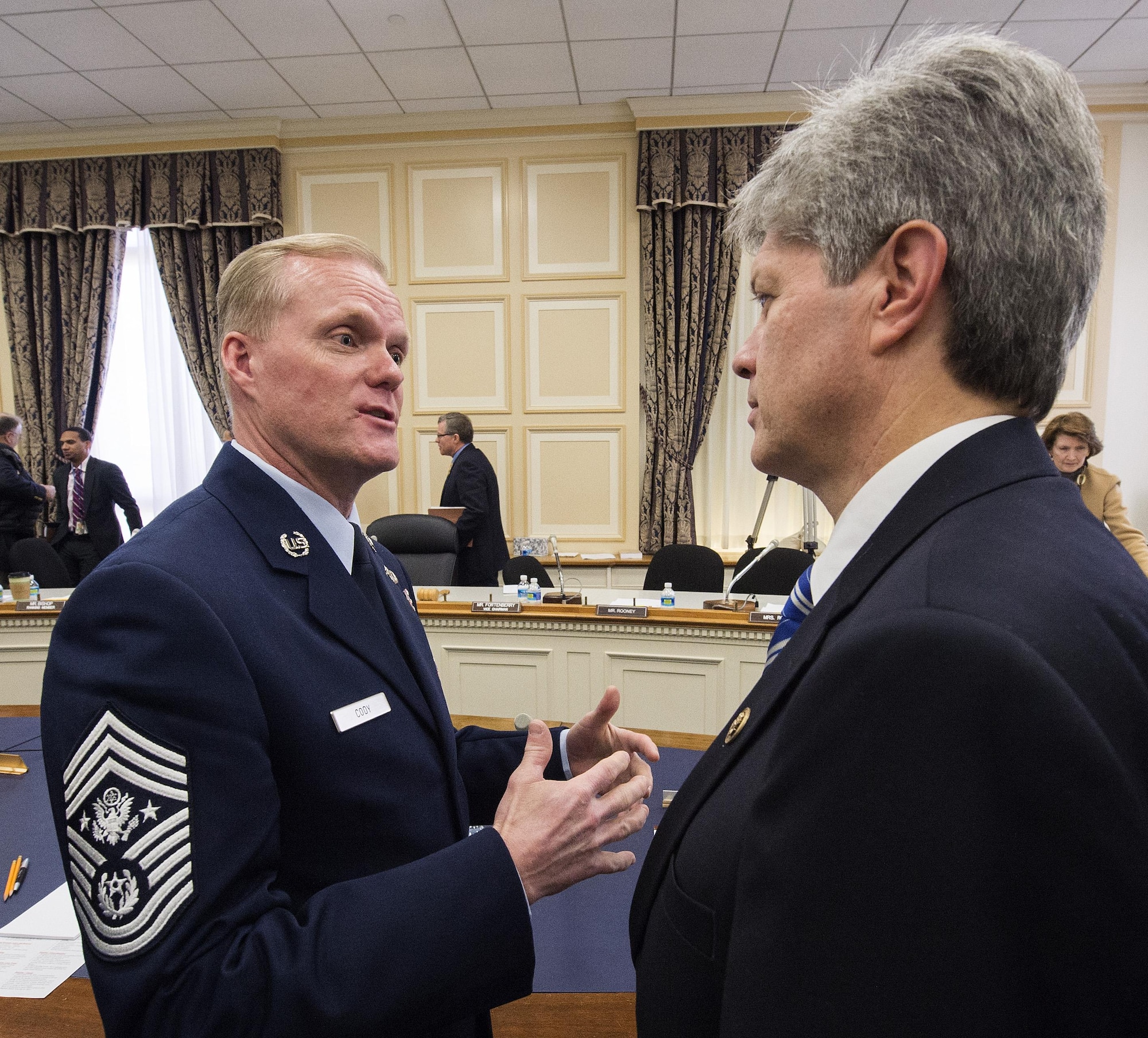 Chief Master Sgt. of the Air Force James A. Cody talks with Rep. Jeff Fortenberry (R-Neb.) following a hearing of the House Appropriations Committee’s Subcommittee on Military Construction and Veterans Affairs Feb. 26, 2016, in Washington, D.C. Fortenberry is vice chair of the subcommittee. The oversight hearing was being held to learn about quality of life in the military concerns from each of the service's senior most enlisted members. During his opening statement Cody stressed the cumulative impacts of sequestered and reduced budgets on the compensation and quality of life of Airmen and their families. Cody stressed that the Airmen who serve today do so freely, proudly and voluntarily because they believe in what America stands for and are ready to defend its cause. He added that our nation must honor that commitment by providing for them and their families. (U.S. Air Force photo/Jim Varhegyi)