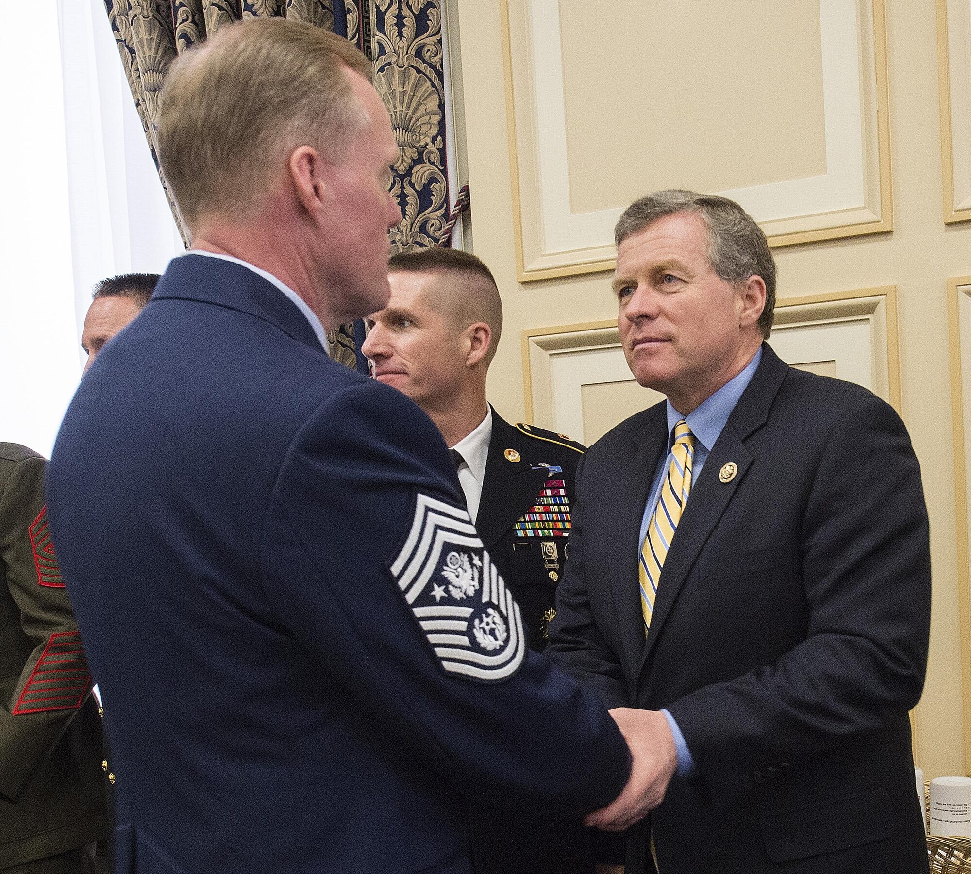 Chief Master Sgt. of the Air Force James A. Cody talks with Rep. Charlie Dent (R-Pa.) following a hearing on Capitol Hill before the House Appropriations Committee’s Subcommittee on Military Construction and Veterans Affairs Feb. 26, 2016, in Washington, D.C. Dent chairs the subcommittee. The oversight hearing was being held to learn about quality of life in the military concerns from each of the service's senior most enlisted members. During his opening statement Cody stressed the cumulative impacts of sequestered and reduced budgets on the compensation and quality of life of Airmen and their families. Cody stressed that the Airmen who serve today do so freely, proudly and voluntarily because they believe in what America stands for and are ready to defend its cause. He added that our nation must honor that commitment by providing for them and their families. (U.S. Air Force photo/Jim Varhegyi)