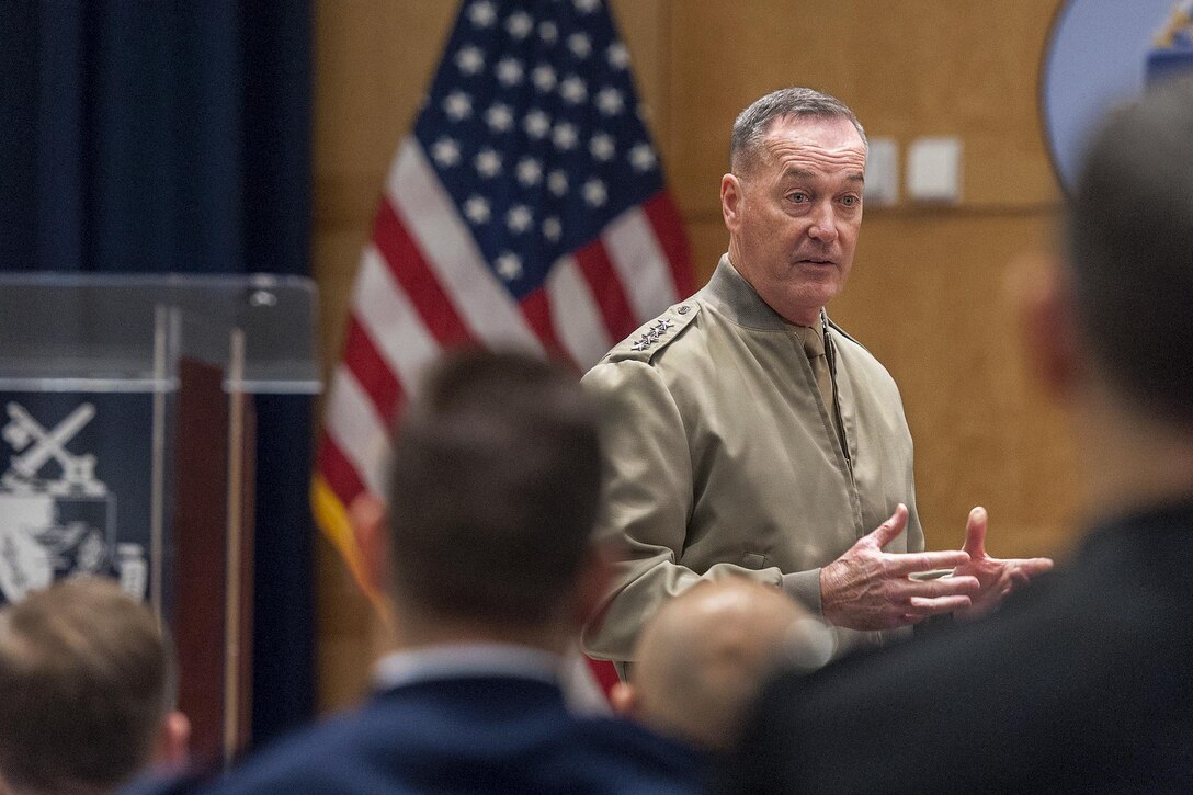 Marine Corps Gen. Joseph F. Dunford, Jr., chairman of the Joint Chiefs of Staff, left, speaks to students and spouses taking a National Defense University Capstone course on Fort McNair in Washington, D.C., Feb. 26, 2016. The Capstone program focuses on making military leaders more effective in planning and employing U.S. forces in joint and combined operations. Courses examine the decision-making process for a variety of concerns, including national security, military strategy and interoperability. Navy Petty Officer 2nd Class Dominique Pineiro