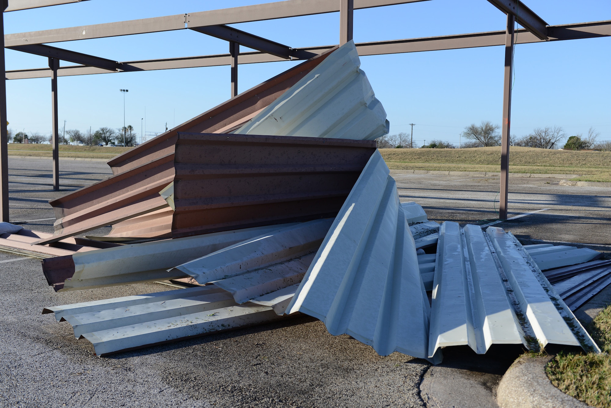 A storm containing 60 plus mph winds and golf ball sized hail hit Laughlin Air Force Base, Texas, at approximately 10:30 p.m. Feb. 22, 2016. With the storm came damaged facilities, housing units and personal property, to include hundreds of dented cars and homes. (U.S. Air Force photo by Senior Airman Jimmie D. Pike)