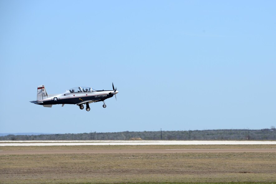 A T-6 Texan II takes off from Laughlin Air Force Base, Texas, Feb. 26. Aircraft are back to flying following a 36-hour lull, after storm containing 60 plus mph winds and golf ball sized hail ravaged the area -- damaging aircraft, base facilities, homes and cars. (U.S. Air Force photo by Airman 1st Class Brandon May)