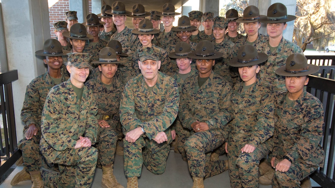 General John M. Paxton, Jr., Assistant Commandant of the Marine Corps, posses with Marines with 4th Recruit Training Battalion, Marine Corps Recruit Depot, Parris Island, South Carolina, Feb. 25, 2016.  Paxton conducted a town hall during his visit to Parris Island this week. The purpose of the town hall was to talk to Marines at the depot and receive feedback on critical issues effecting them.  Paxton also served as the guest of honor for the graduation ceremony Feb. 26, in which new Marines from Companies G and P concluded their basic training and joined the Corps’ ranks to carry on its more than 240-year legacy. 