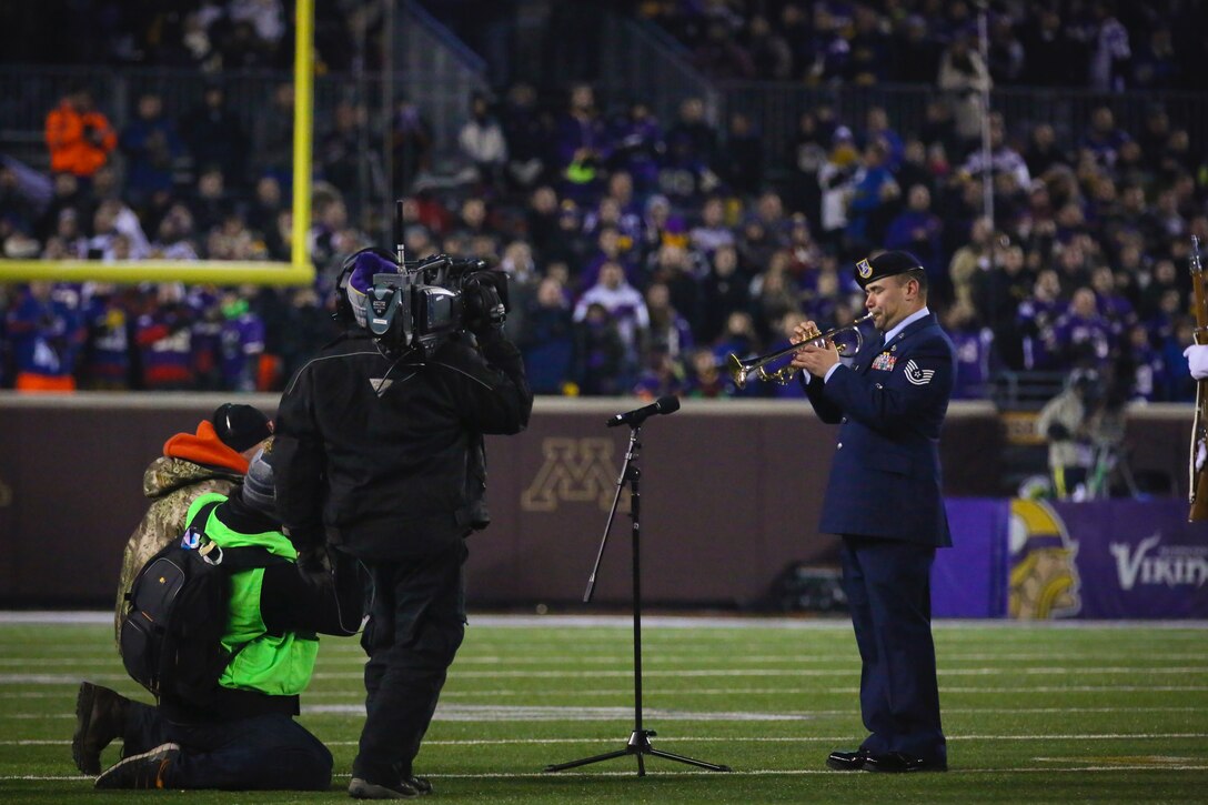 Tech. Sgt. Johnny Holliday plays the National Anthem at the Minnesota Vikings vs. New York Giants NFL playoff game Dec. 27. (Courtesy Photo by Nathan Wallin)