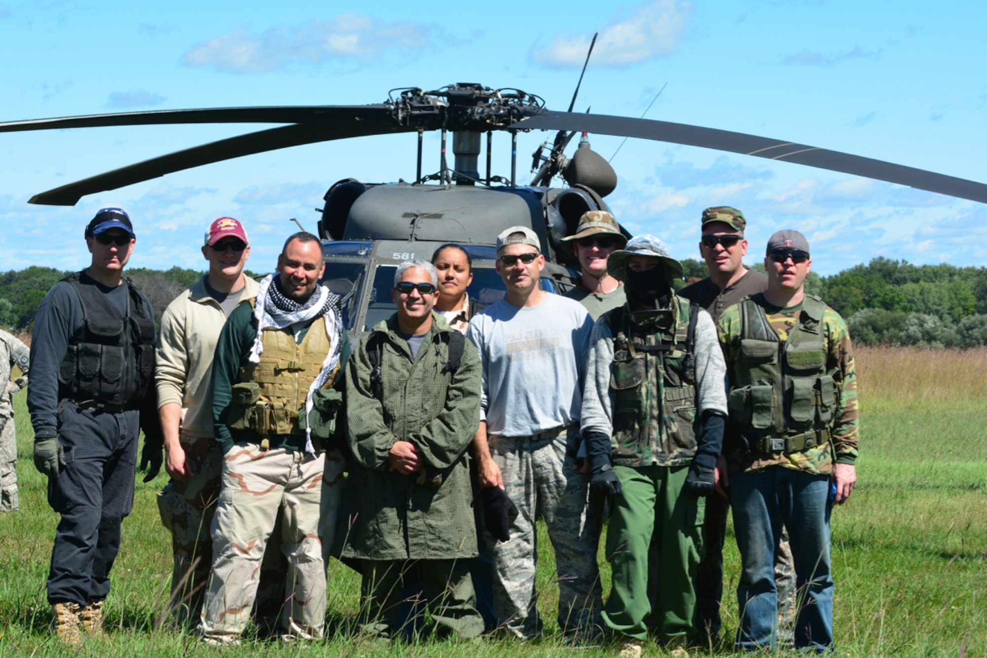 Tech. Sgt. Johnny Holliday (3rd from left) plays the role of Opposition Force during an exercise August 25 with the 934th Security Forces Squadron and members of the Minnesota Air and Army National Guard. (Air Force Photo/Paul Zadach)