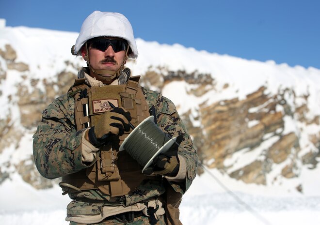 Sgt. Nick Green, Explosive Ordnance Disposal technician from 2nd EOD Company, Combat Logistics Battalion 252 winds up a spool of detonation cord in Rena, Norway, Feb. 22, 2016, in preparation for Exercise Cold Response 16. The exercise will include 12 NATO allies and partner nations, and approximately 16,000 troops. Marines will train alongside Norwegian EOD specialists to see how they operate in order to become more proficient at working with each other in the future.