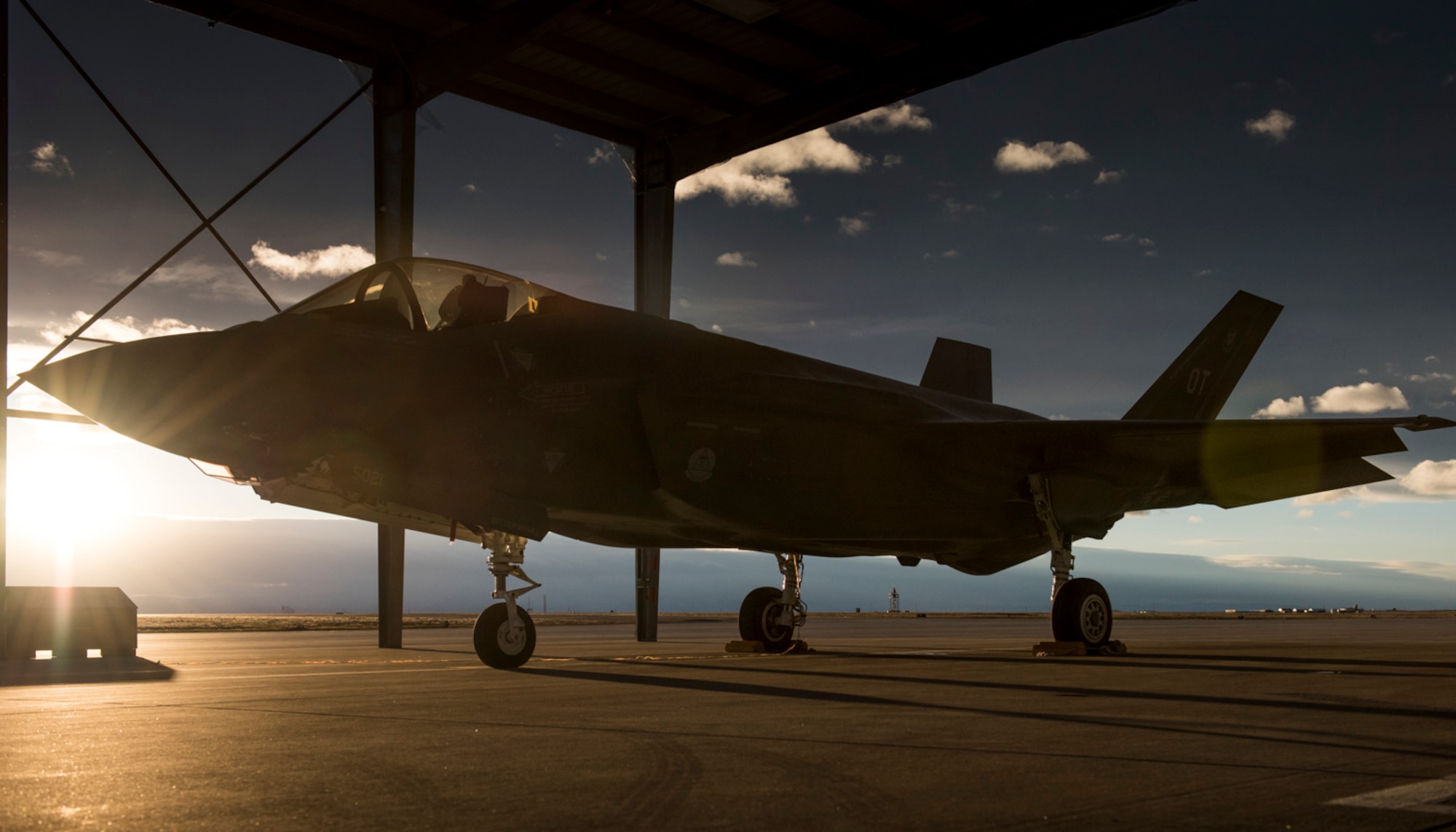 An F-35A Lightning II parks for the night under the sunshades at Mountain Home Air Force Base, Idaho, Feb. 18, 2016. The F-35s’ combat capabilities are being tested through an operational deployment test at Mountain Home AFB range complexes. (U.S. Air Force photo/Senior Airman Jeremy L. Mosier)