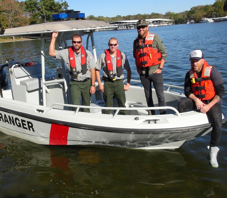 Preston Brust (second from right) and Chris Lucas (Right) of the country music duo LoCash pose with U.S. Army Corps of Engineers Park Rangers Jacob Albers (Left) and Brent Sewell at Old Hickory Lake in Hendersonville, Tenn, Oct. 19, 2015.  The group filmed a water safety PSA that features LoCash’s hit song "I Love This Life," which is currently moving up the country music charts. It is being used to support the USACE National Water Safety Campaign “Life Jackets Worn, Nobody Mourns.”