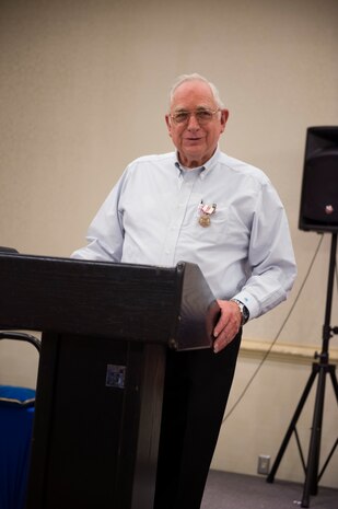 Frank Metzger, a 437th Airlift Wing program analyst with 54 years of federal service,,  addresses family, friends and coworkers during his retirement ceremony, Feb. 23, 2016, at Joint Base Charleston, S.C. Metzger served in the military as a navigator for 24 years and a civil servant for 30 years. His first assignment was with the 1608th Air Transport Wing at Charleston Air Force Base. (U.S. Air Force photo/Staff Sgt. Jared Trimarchi)