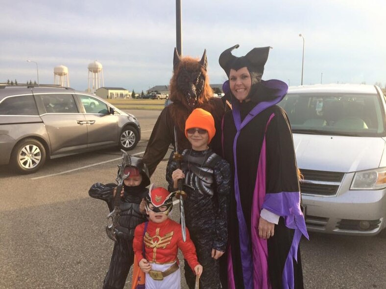 Sylvia Wages and her family dress up to pass out candy for the Airmen dorm 
trick or treat on Halloween. Wages, spouse of 5th Aircraft Maintenance 
Squadron specialist section chief MSgt. William Wages, was recently named Air 
Force Global Strike Command Volunteer of the year. (Courtesy photo)
