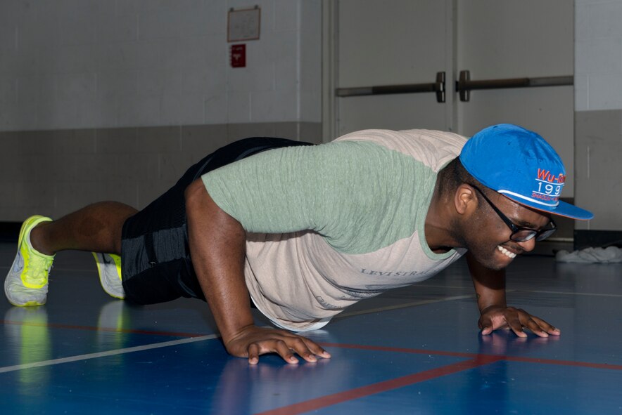 1st Lt. Skylar Ward, 741st Missile Squadron deputy combat crew commander, performs a pushup during a fitness challenge at Minot Air Force Base, N.D., Feb. 20, 2016. The fitness challenge, hosted by the African American Heritage Committee, consisted of exercises such as jumping jacks, squats, pushups, planks and burpees. (U.S. Air Force photo/ Senior Airman Sahara L. Fales)