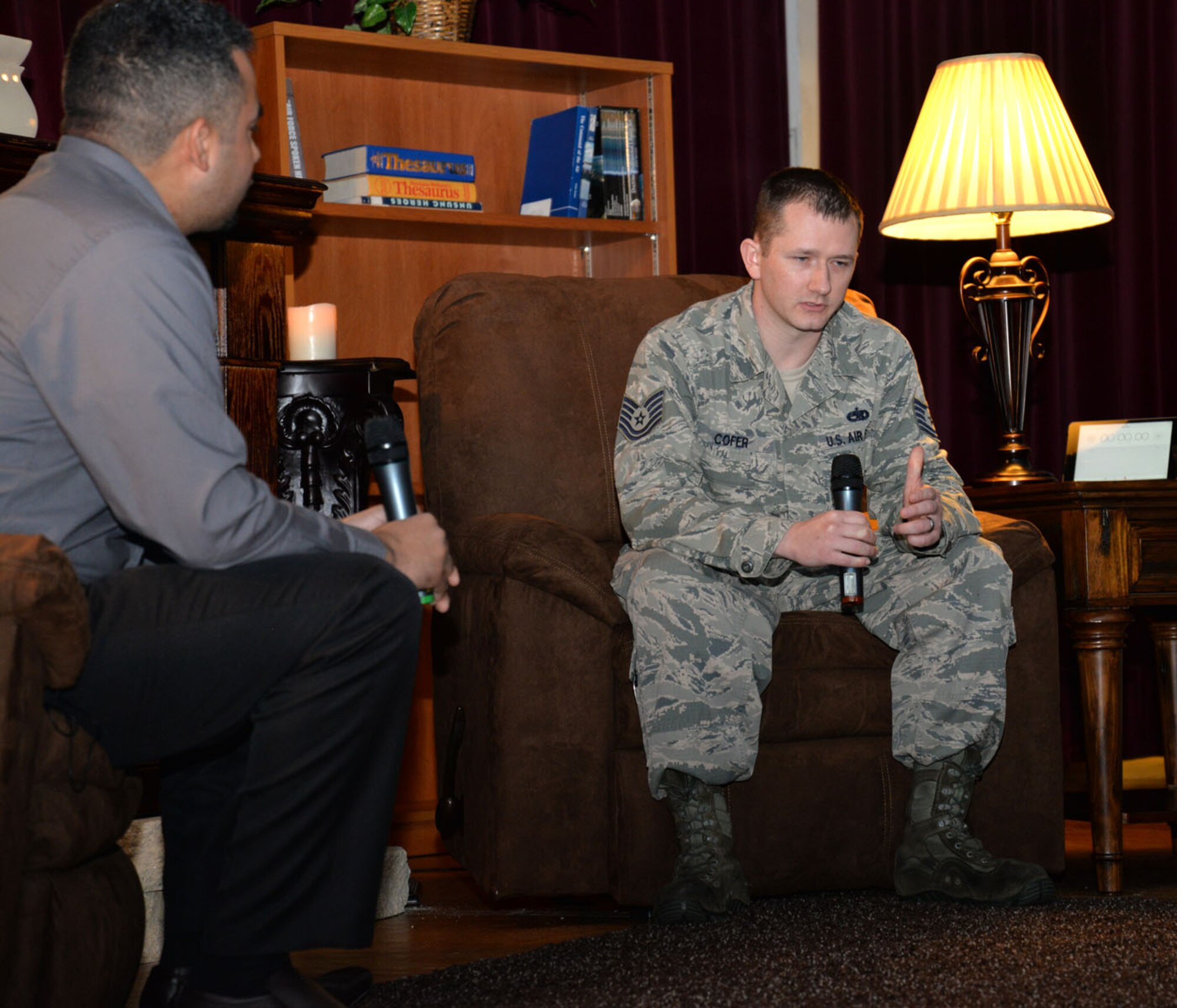 U.S. Air Force Tech. Sgt. Cameron Cofer, right, 100th Maintenance Squadron NCO in charge of AGE services, shares his experiences with Team Mildenhall Airmen about being brought up in a broken, abusive home, and his daughter being born with two holes in her heart, during a “Storytellers” event Feb. 22, 2016, on RAF Mildenhall, England. The motto of Storytellers is, “Every Airman has a story,” and is an avenue for Airmen to share their stories with others. (U.S. Air Force photo by Karen Abeyasekere)