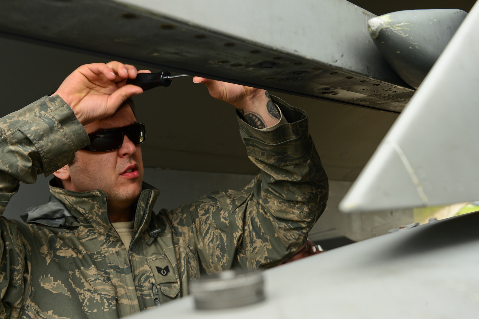 Staff Sgt. Jason Trehearne, 493rd Aircraft Maintenance Unit weapons load crew member, installs a buffer on a LAU-128 missile launcher, during exercise Real Thaw at Beja Air Base, Portugal, Feb. 25, 2016. Real Thaw was designed to provide joint interoperability training through the execution of a vast range of battlefield missions, to include day and night operations in a high intensity joint setting. (U.S. Air Force photo by Senior Airman Dawn M. Weber/Released)