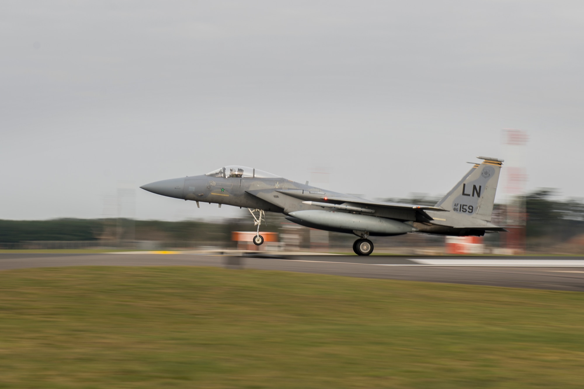 Lt. Col. John Stratton, 493rd Fighter Squadron commander, lands after earning his 2,000-hour flying patch in the F-15C Eagle at Royal Air Force Lakenheath, England, Feb. 26, 2016. More than 30 friends, family members and fellow Airmen gathered to celebrate Stratton’s achievement.  (U.S. Air Force photo/Airman 1st Class Erin R. Babis)
