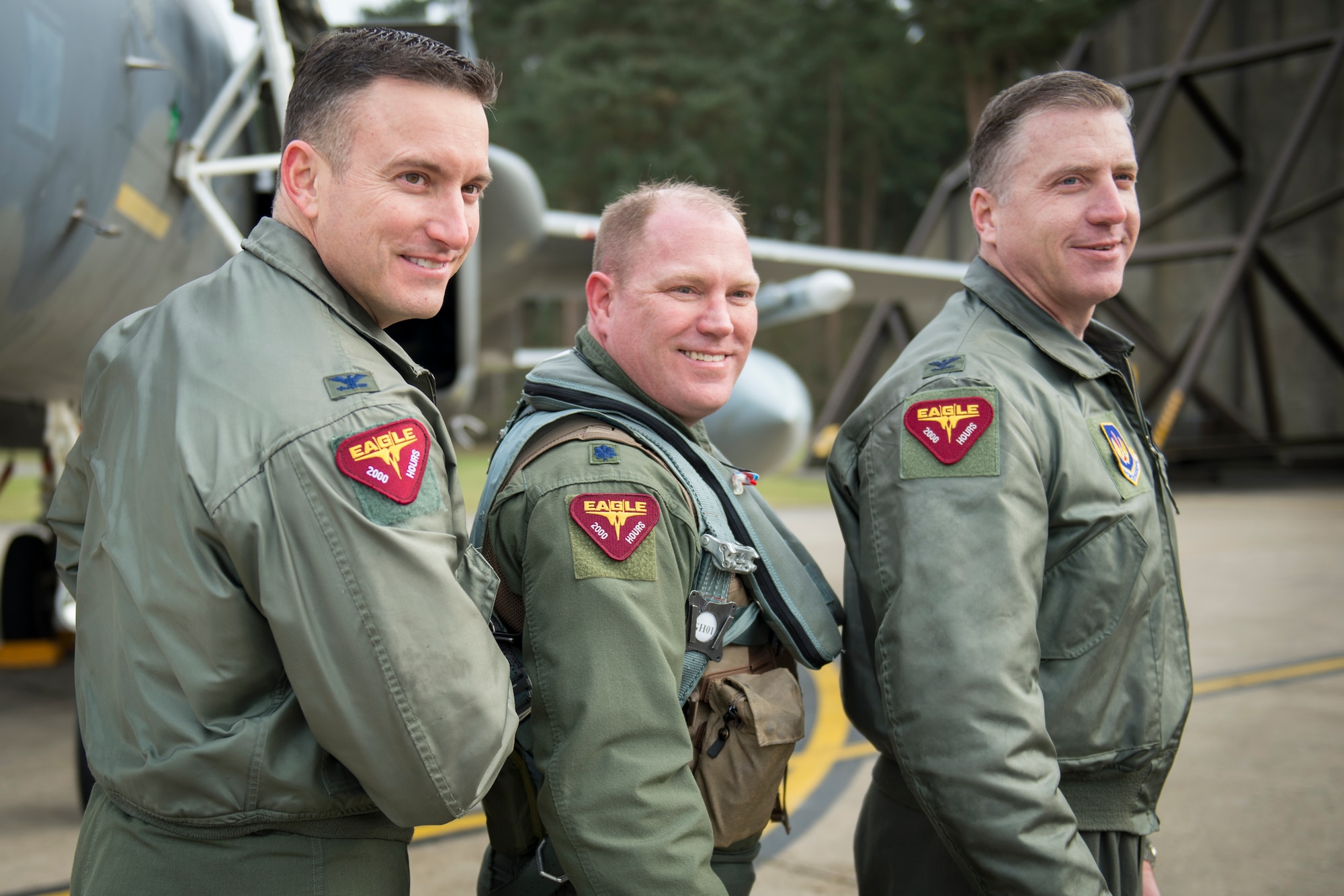 Lt. Col. John Stratton, 493rd Fighter Squadron commander, center, poses with Col. Robert Novotny, 48th Fighter Wing commander, left, and Col. David Eaglin, 48th FW vice commander, after earning his 2,000-hour flying patch in the F-15C Eagle at Royal Air Force Lakenheath, England, Feb. 26, 2016. More than 30 friends, family members and fellow Airmen gathered to celebrate Stratton’s achievement. (U.S. Air Force photo/Airman 1st Class Erin R. Babis)