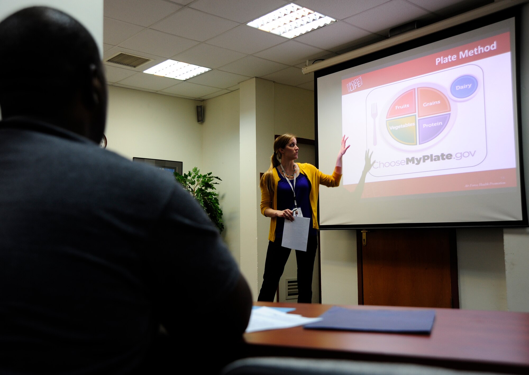 Emily Arthur, 39th Medical Operations Group health promotion program coordinator, speaks during a “Better Body Better Life” course about healthy food diets Feb. 24, 2016, at Incirlik Air Base, Turkey. The series focuses on improving overall health for individuals by managing their behavior and offering them better alternative to negative habits. (U.S. Air Force photo by Airman 1st Class Daniel Lile/Released)