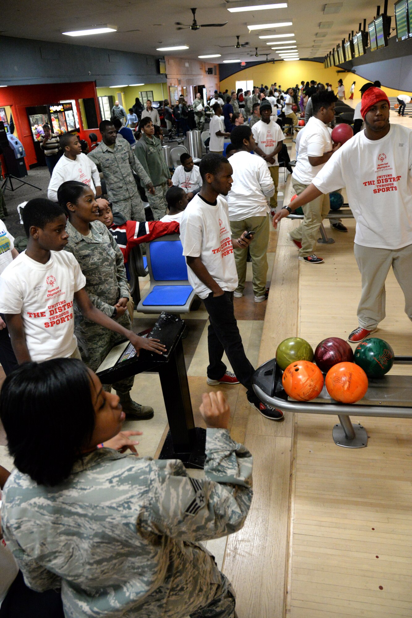 Military members from all branches of service assist athletes during the D.C. Special Olympics Bowling Championship in Hyattsville, Md., Feb. 25, 2016. More than 70 Airmen from across the National Capital Region volunteered to support athletes competing in the event. (U.S. Air Force photo/Tech. Sgt. Matt Davis)